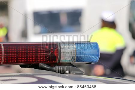 Red And Blue Siren Police Car During The Roadblock