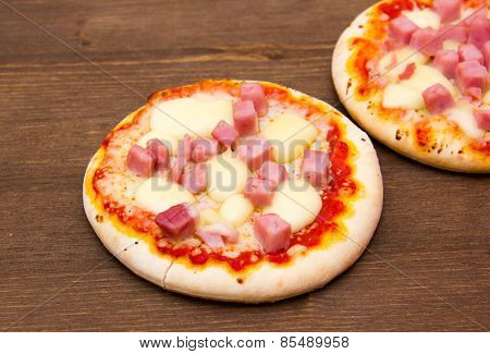 Mini pizzas on wood