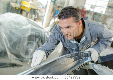 Sanding down a car