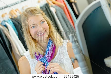Trying on a scarf in a shop