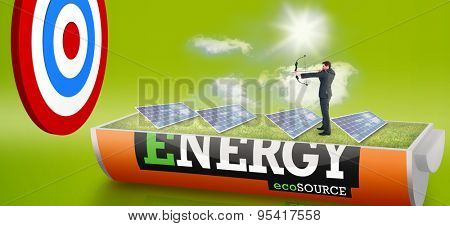 Businessman shooting a bow and arrow against solar panels in a sunny field in an energy saving battery