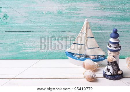 Decorative Lighthouse,  Sailing Boats And Marine Items On Wooden Background.
