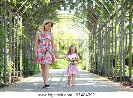 young mother with daughter in park