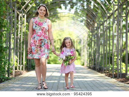 young mother with daughter in park