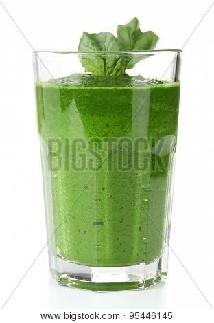 Glass of green vegetable juice with basil isolated on white