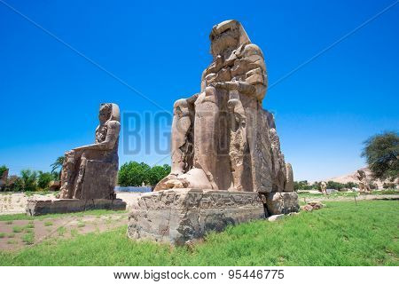 Egypt. Luxor. The Colossi of Memnon - two massive stone statues of Pharaoh Amenhotep III