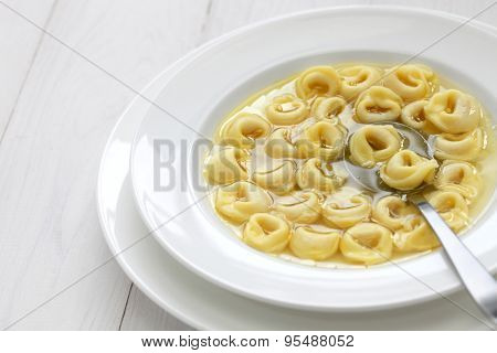 tortellini in brodo, ring shaped pasta in broth, italian emilia romagna soup cuisine