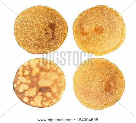 Texture of a four different round thin pancakes on a light background