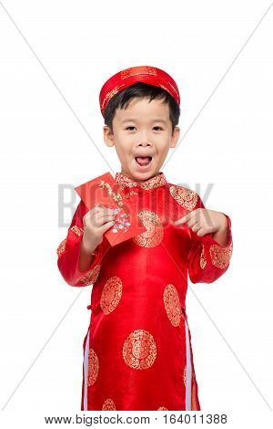 Little Vietnamese boy holding red envelops for Tet. The word mean double happiness. It is the gift in lunar new year or Tet Holiday on red isolate background.