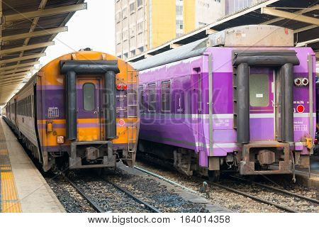 BANGKOK, THAILAND - DECEMBER 13, 2016: Trains waits at a platform of railway station Hua Lamphong in Bangkok. Hua Lamphong opened in 1916 and serves apprx 70,000 passengers and 150 trains each day.