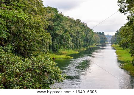 River through Los Naranjos national park with Lake de Yojoa hardly visible through the haze on the background Honduras