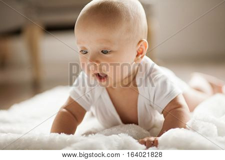 Portrait Of Small Surprised Baby.