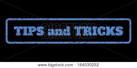 Blue rubber seal stamp with Tips and Tricks text. Vector tag inside rounded rectangular shape. Grunge design and dirty texture for watermark labels. Horisontal sign on a black background.