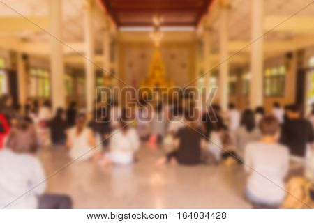 Abstract blur he monks and Thai Buddhist are praying in church in day time can be used as background