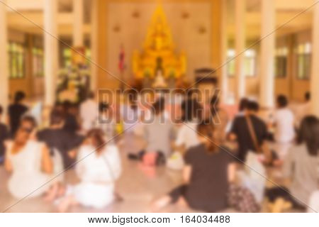 Abstract blur he monks and Thai Buddhist are praying in church in day time can be used as background