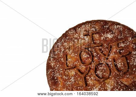 Photo by pie with a declaration of love in the lower right corner on the white background.