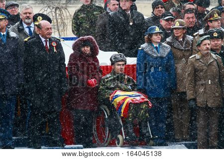 BUCHAREST ROMANIA - DECEMBER 1 2014: A war veteran is taking part next to the Romanian president and other officials to a military parade on National Day of Romania. More than 3000 soldiers and personnel from security agencies take part in the massive par