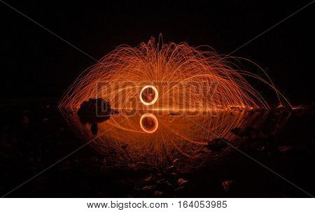 mirror burning steel wool on the beach