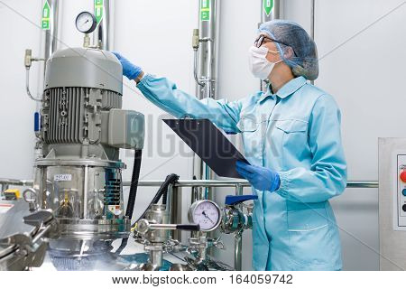 Scientist Monitors The Readings On The Equipment