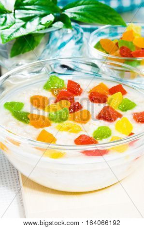 Oatmeal With Colorful Candied Fruits In A Glass Bowl