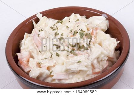 photo of pot of coleslaw isolated on a white background
