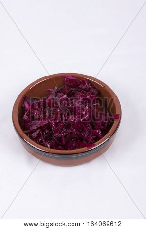 photo of pot of red coleslaw isolated on a white background