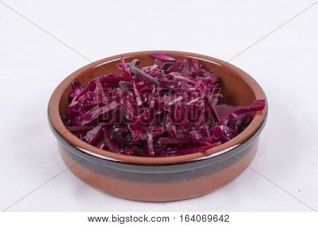 photo of pot of red coleslaw isolated on a white background