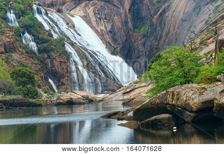 Mountain Waterfall And Summer River.