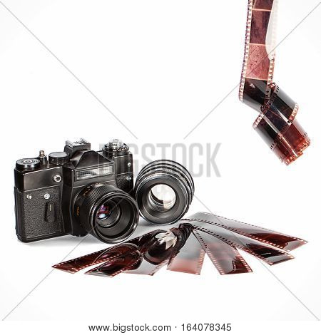 Old film camera and film. Isolation on a white background. Vintage. The camera of the last century