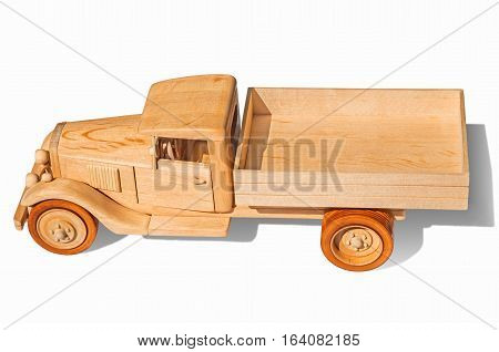 Wooden model of retro freight car on a white background