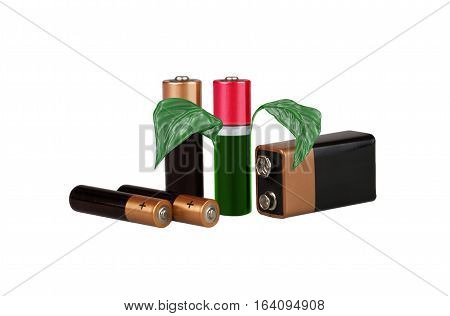 Environmental-friendly energy sources, batteries, on a white background, with green leaves, isolated, montage