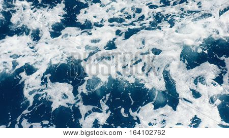 Restless foamy blue sea water from above