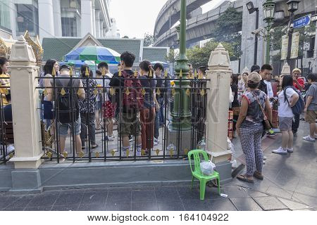 BANGKOKTHAILAND - DEC 31 : view of crowd in Erawan shrine from outside while new year festival on december 31 2016 Thailand. Erawan shrine is famously sacred place in bangkok