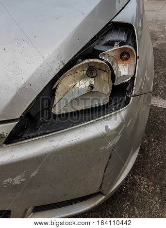 Car an accident with headlight damage left