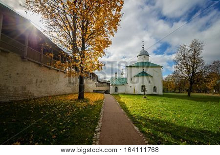 Sunny day in the old fortress. The picture shows a church and fortress wall.