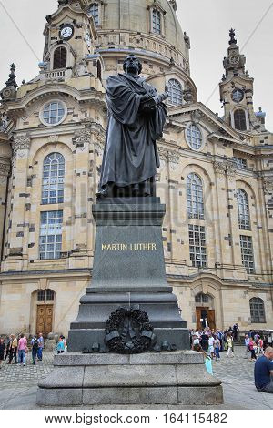 DRESDEN GERMANY - AUGUST 13 2016: Frauenkirche (Our Lady church) and statue Martin Luther in the center of old town in Dresden Germany in Dresden Germany on August 13 2016.