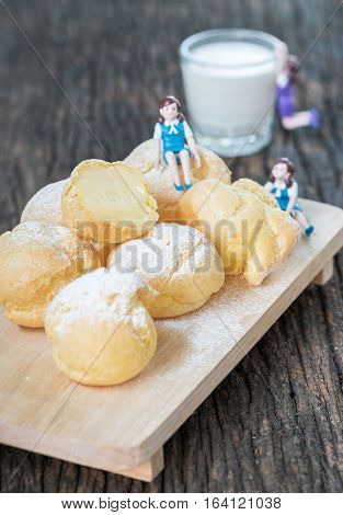 Custard In Chu-cream Or Eclair On Wood Block