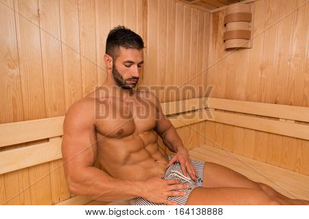 Portrait Of A Muscular Man Relaxing In Sauna