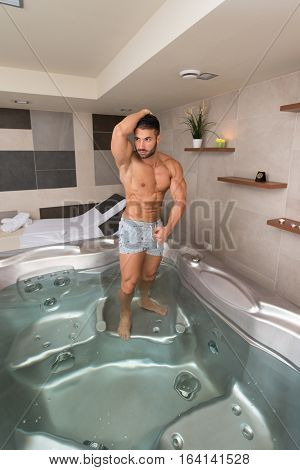 Flexing Muscles In Hot Tube Jacuzzi