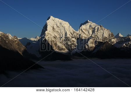 View from Gokyo Ri Everest National Park. Snow covered mountains Cholatse and Taboche.