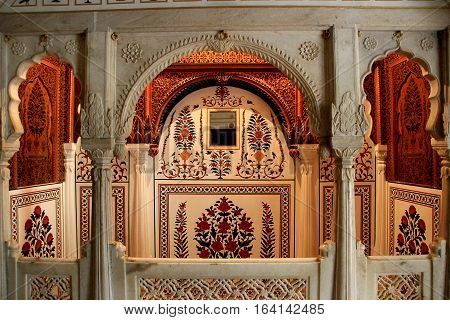 Decorative floral motif etched on walls of marble cubicle at Junagarh Fort Bikaner Rajasthan India Asia