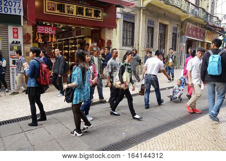 MACAU CHINA - NOVEMBER 28 2016: Typical shopping street in the Special Administrative Region of Macau in Southern China.