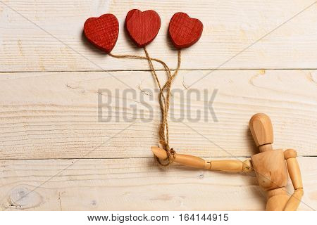 Gestalta Or Poppet Toy Holding Hearts