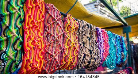 Row of colorful fabric at Feria de Mataderos