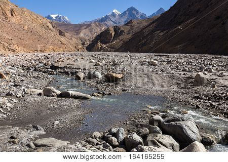 road over a stream in a mountain gorge, Himalaya Nepal