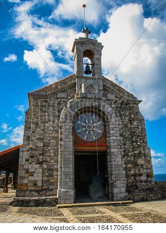 Gastelugache -  island on  coast of  Bay of Biscay belonging to  municipality of Bermeo, Basque Country.  Island is connected to  mainland by  man-made bridge that goes into  winding staircase that spans 237 degrees.