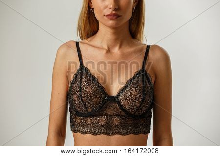 Beautiful sexy fitness blonde posing in lingerie on white background, catalog, book