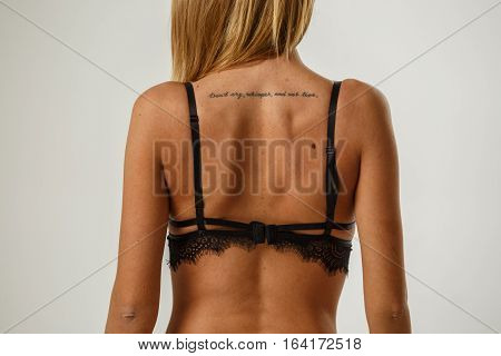 Beautiful sexy fitness blonde posing in lingerie on white background, catalog, book