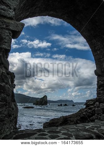 Gastelugache -  island on  coast of  Bay of Biscay belonging to  municipality of Bermeo, Basque Country.  Island is connected to  mainland by  man-made bridge that goes into  winding staircase that spans 237 degrees.