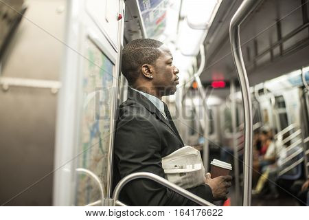 Businessman in full suit in New York subway metro